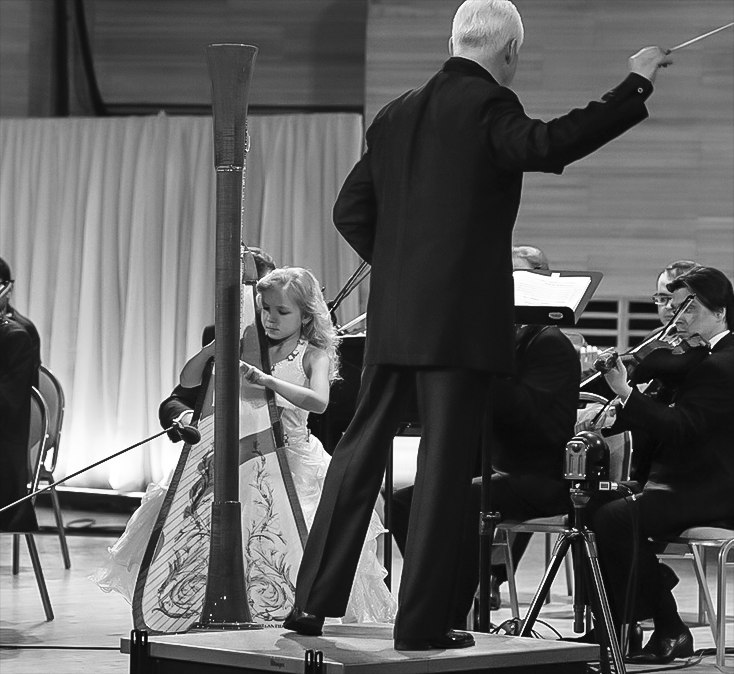 Alisa performing with an orchestra conducted by Vladimir Spivakov
