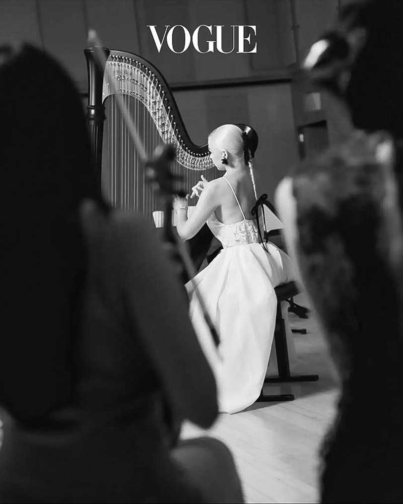 Alisa playing the harp in a Vogue fashion editorial